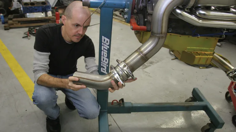 Mechanic Installing Turbo or Exhaust Upgrade