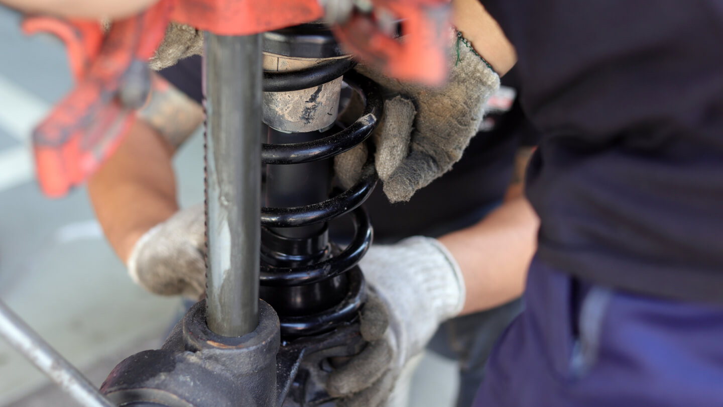 Mechanic Installing Suspension Strut